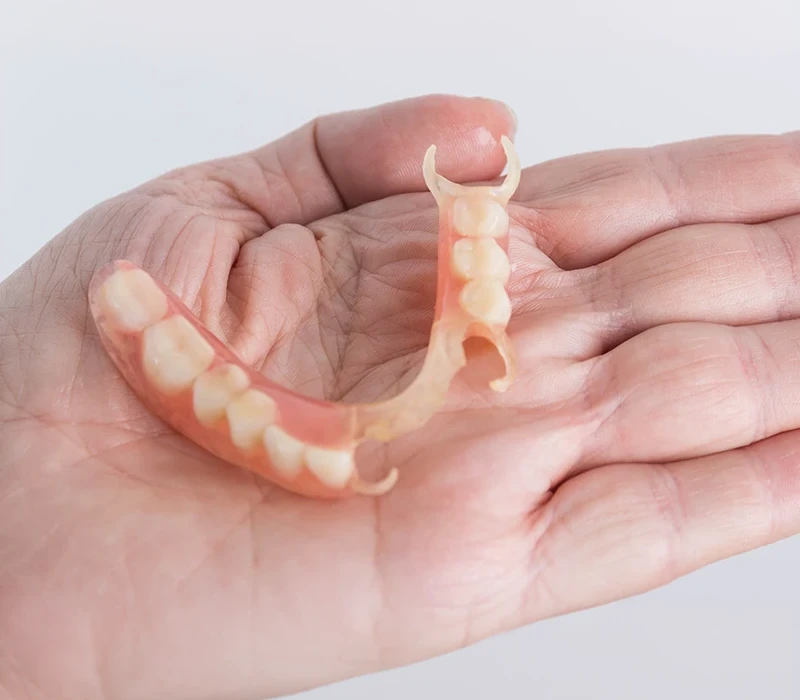 3D Printed Dentures on female hand